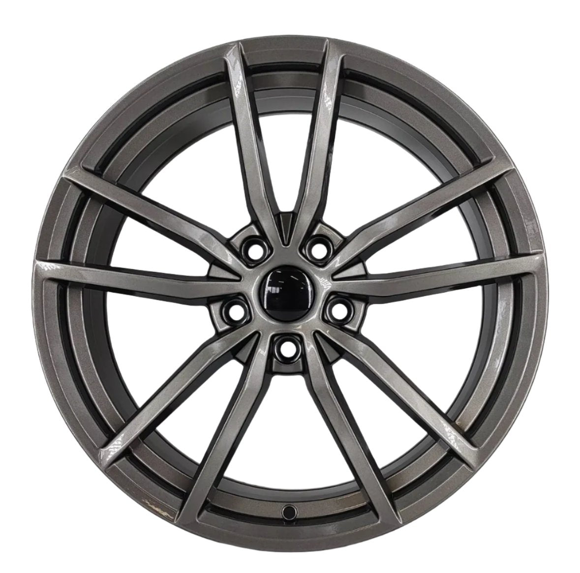 A sleek, polished alloy wheel with a multi-spoke design, featuring a central hub surrounded by five bolt holes. The wheel is isolated against a plain, white background.