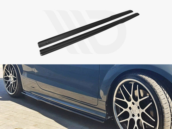 Two black car side skirts, photographed separately and also installed on a blue car with black and silver alloy wheels, parked on a brick surface.