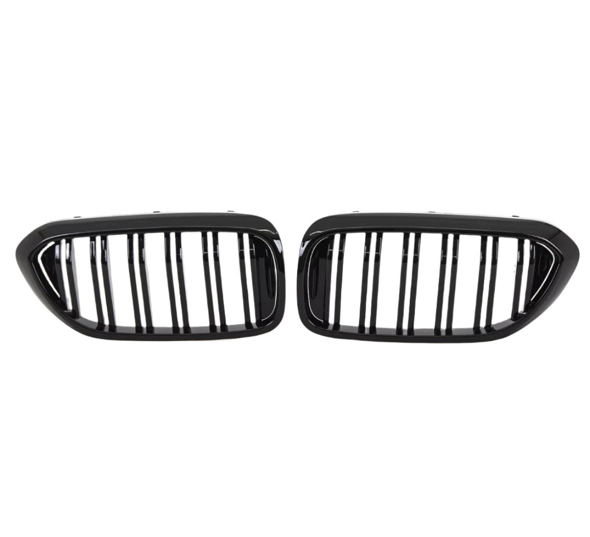 Two black, oval car grilles with vertical bars sit side by side against a white background, indicating they are designed for a vehicle's front end.