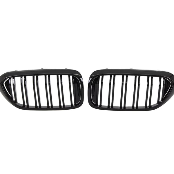 Two black, oval car grilles with vertical bars sit side by side against a white background, indicating they are designed for a vehicle's front end.