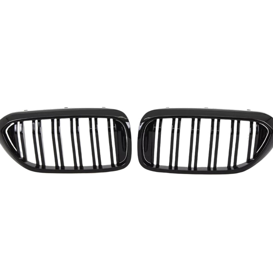 Two black, oval car grilles with vertical bars sit side by side against a white background, indicating they are designed for a vehicle's front end.