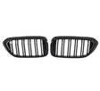 Two black, oval car grilles with vertical bars sit side by side against a white background, indicating they are designed for a vehicle's front end.