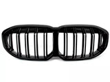 Black car grille with vertical slats, designed in a double kidney shape, isolated on a white background.