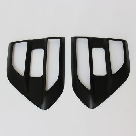 Two black, angular car air vent covers with rectangular openings positioned side by side on a white background.
