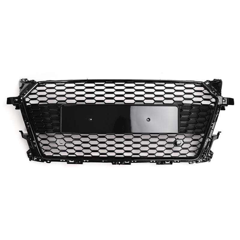 A black honeycomb-patterned car grille is displayed on a white background. It features a central rectangular area for a license plate or emblem.