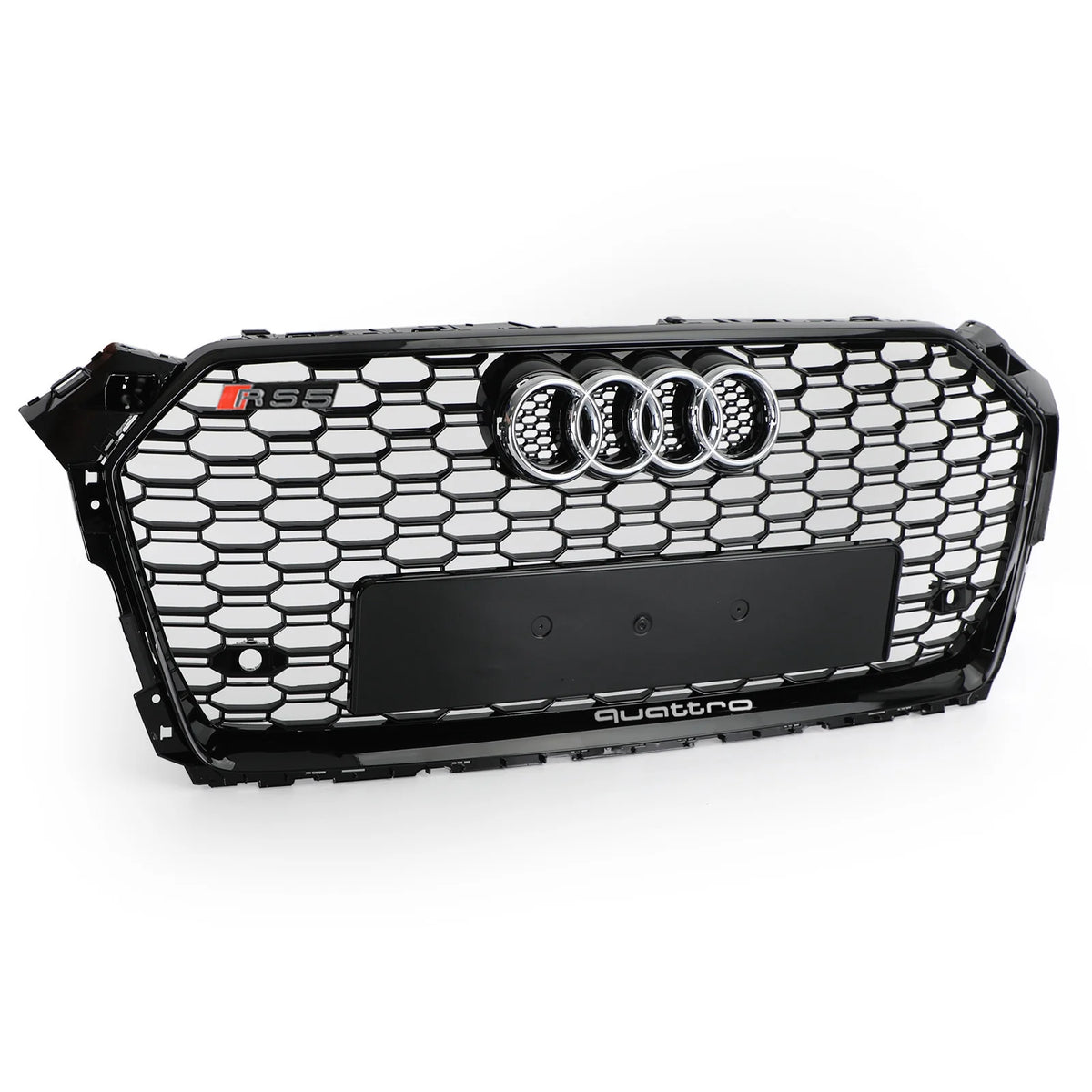 A black Audi car grille with a honeycomb pattern features a chrome Audi emblem, "RS5" badge, and the word "quattro" at the bottom, displayed against a plain white background.