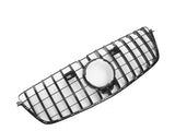 A black car grille featuring a central circular emblem area, with a grid pattern, is displayed against a plain white background.