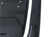 Black, rectangular car panel with screws, positioned adjacent to a matching curved piece. Both lie against a plain white background, showcasing their sleek, glossy surfaces.