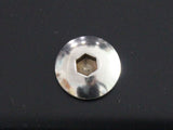 A metallic hex socket screw head embedded in a smooth, dark surface, reflecting light. The background is glossy, enhancing the screw's shiny appearance.