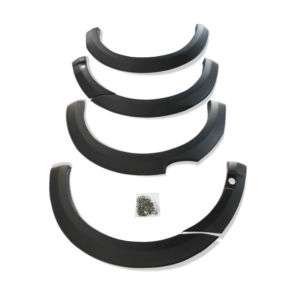 Four black car fender flares are arranged in descending size order. A small plastic bag containing screws lies in the center on a white background.