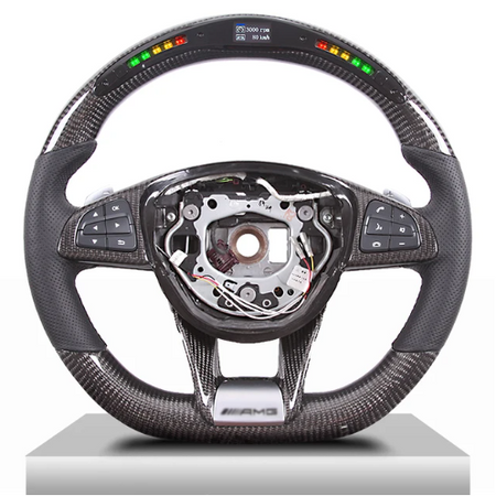 A carbon-fiber steering wheel features multifunction buttons on the sides and a digital display at the top. The center is missing, revealing internal mechanisms. Display text: "3000 RPM, 120 km/h."