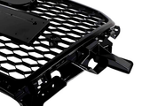 A black car grille with a honeycomb pattern and mounting brackets is positioned against a white background.