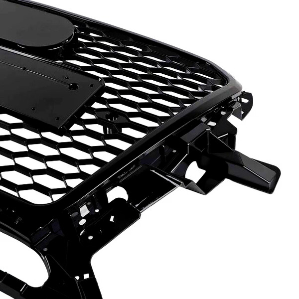 A black car grille with a honeycomb pattern and mounting brackets is positioned against a white background.