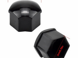 Black plastic lug nut covers with hexagonal openings and smooth domed tops, measuring 2.5 cm (0.98 in) wide and 2 cm (0.78 in) deep.