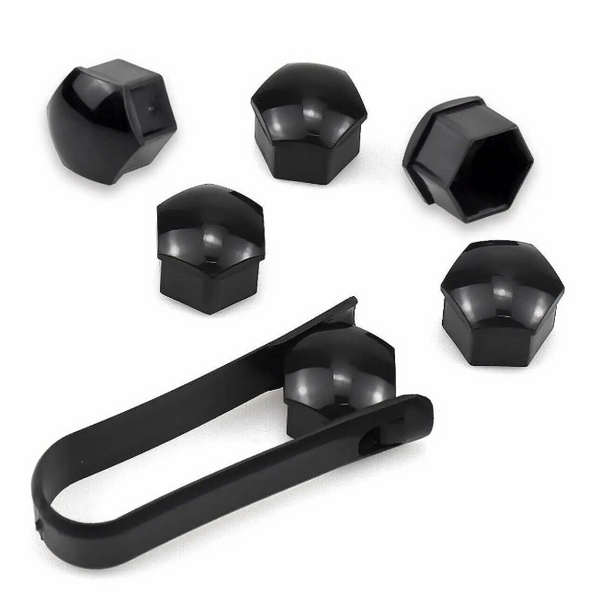 Black lug nut covers and a removal tool are arranged on a plain background. The covers are hexagonal, reflecting light, while the tool is elongated with gripping ends for ease of use.
