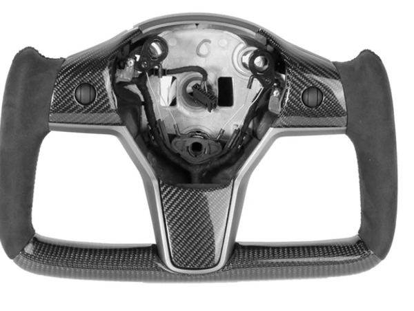 A carbon-fiber steering wheel frame, without a central panel or buttons, rests on a plain white background, showing sleek ergonomic grips and precise craftsmanship.