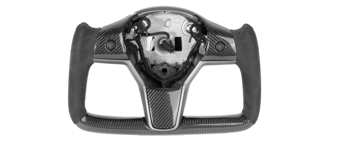 Steering wheel center; partially assembled carbon fiber; missing inner components; black grips. It has a sleek, modern design, suggesting use in high-performance vehicles or simulators. The background is plain white.