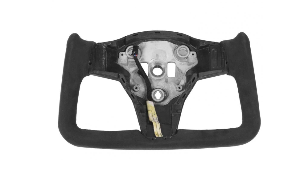 Rectangular steering wheel with a central frame and exposed wiring, set on a plain white background. It appears incomplete, likely for automotive or racing use.