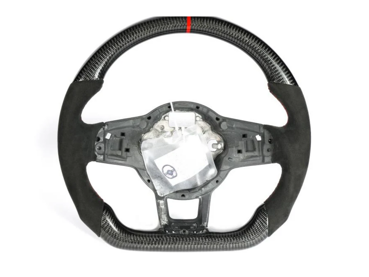 A carbon-fiber steering wheel with a red stripe at the top and a partially exposed interior mechanism, displayed against a plain white background.