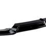 A black car front bumper spoiler, curved with vertical fins, is placed against a plain white background. It is designed to enhance aerodynamics and aesthetics.