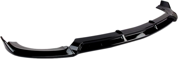 A black car front bumper spoiler, curved with vertical fins, is placed against a plain white background. It is designed to enhance aerodynamics and aesthetics.