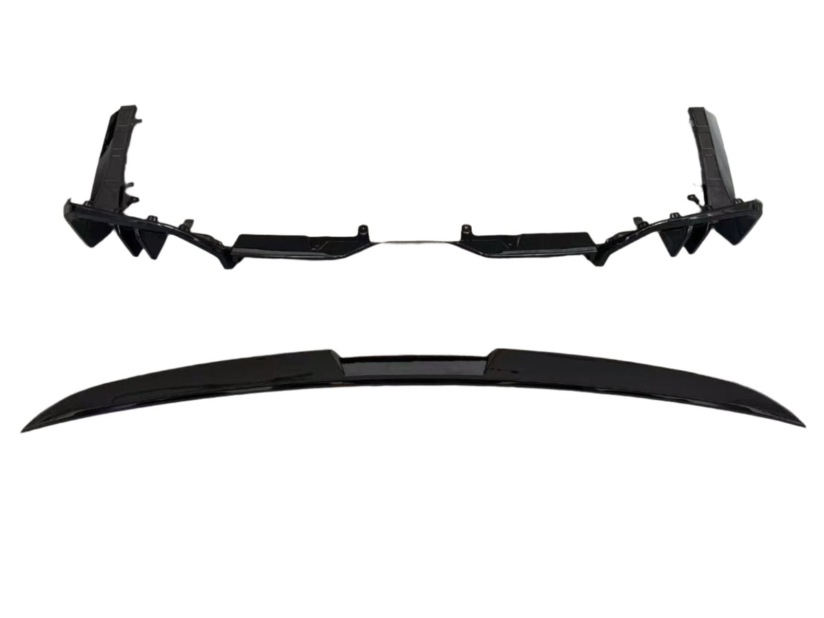 Two sleek black car parts, likely a bumper and a spoiler, are aligned parallel on a white background, showcasing their aerodynamic design and smooth surfaces.