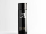 Black cylindrical deodorant can labeled 