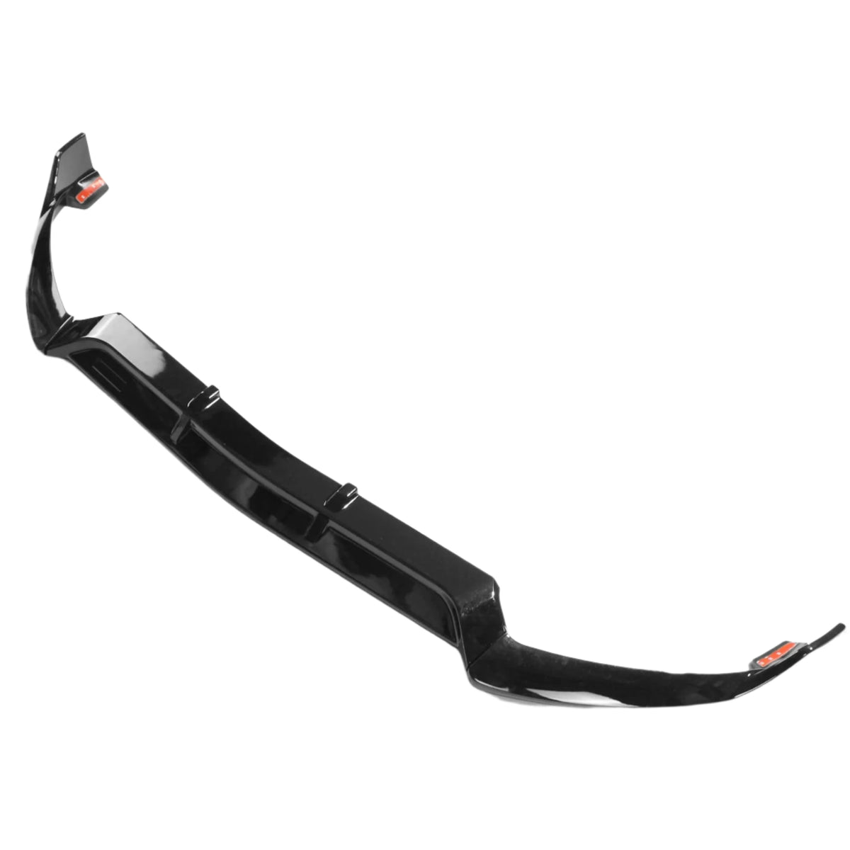 A black car front splitter lies on a white background. It features a glossy finish and has aerodynamic curves at the edges for performance enhancement.