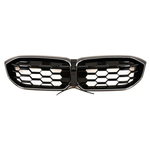 A black car grille with honeycomb design, featuring two separate sections joined in the center. Wires protrude from the middle, suggesting electronic integration. The background is plain white.