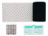 A collection of medical supplies including a black Velcro band, adhesive strips labeled 