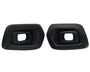 Two black exhaust tips with rectangular openings are facing forward. They are placed side by side against a plain white background.