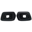 Two black exhaust tips with rectangular openings are facing forward. They are placed side by side against a plain white background.