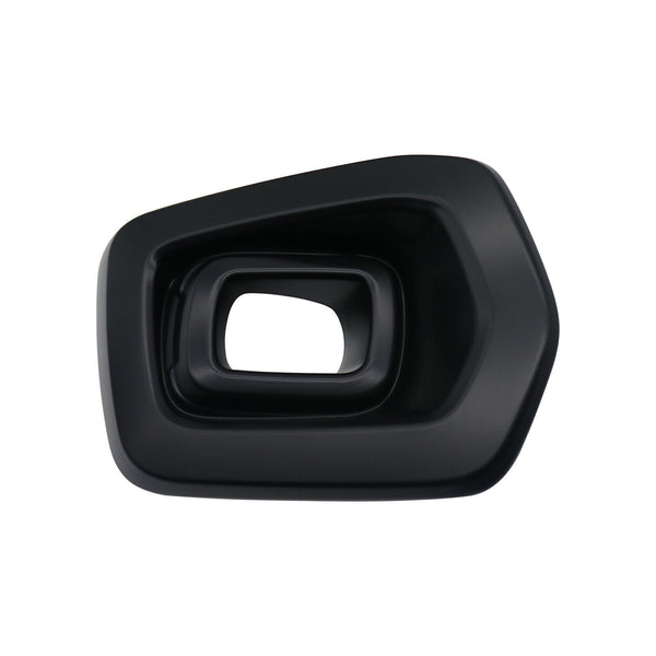 A black, geometrically shaped plastic object with layered, beveled edges, sits isolated against a plain white background. The object has a central rectangular opening.
