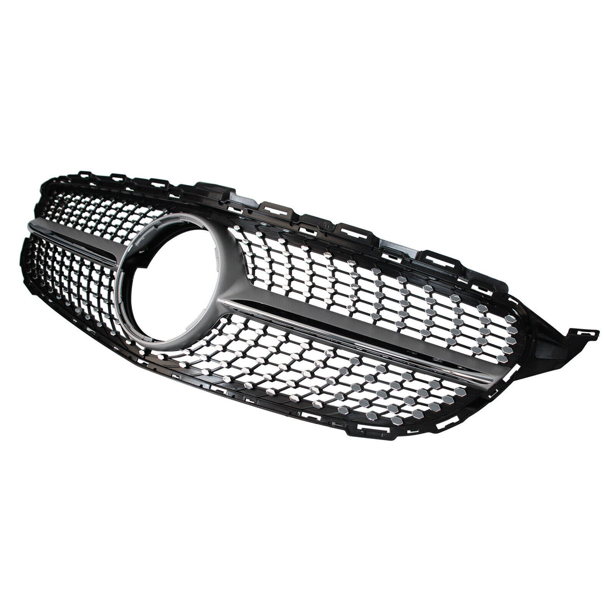 A black car grille features a honeycomb pattern with a circular opening in the center. It is isolated against a plain white background.