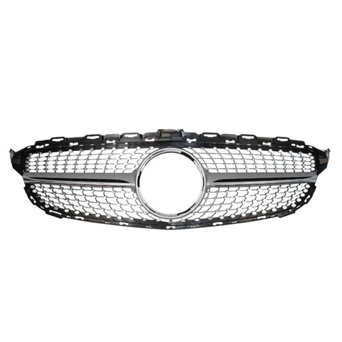 A chrome and black car grille with a honeycomb pattern features a circular emblem space in the center, set against a plain white background.
