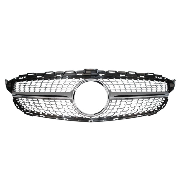 A chrome and black car grille with a honeycomb pattern features a circular emblem space in the center, set against a plain white background.