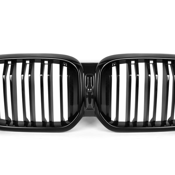 A black, dual-oval car grille with vertical slats, centrally connected, lies against a plain white background, indicating an automotive part typically used for front vehicle aesthetics and ventilation.
