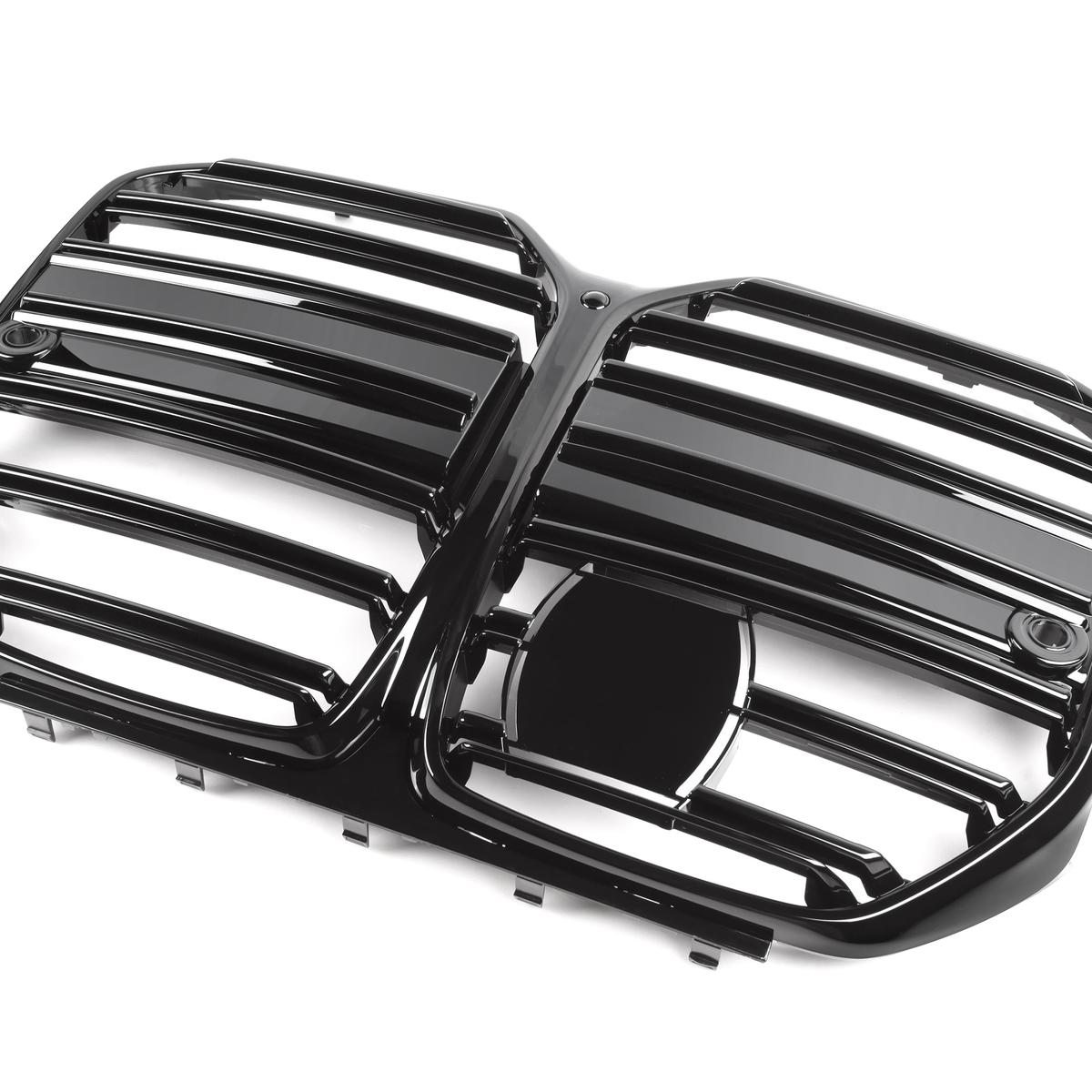 A glossy black automobile grille with horizontal slats, featuring two side-by-side sections and a central emblem space, is positioned against a plain white background.