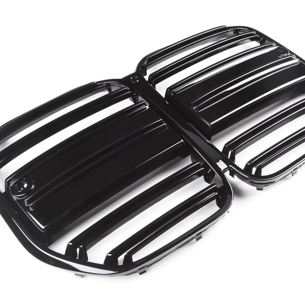 Black, glossy car grille displaying horizontal slats is placed on a plain, white background, suggesting a focus on automotive design and functionality.