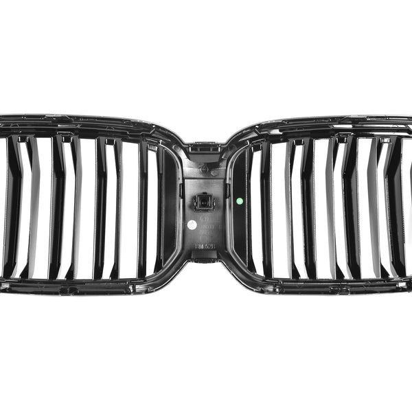 A dual-sectioned black car grille features vertical slats, symmetrically split at the center. It's isolated on a white background, highlighting its glossy finish.