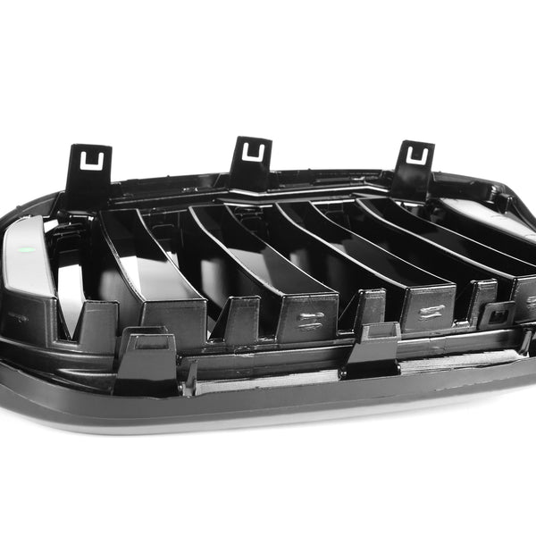 A black car grille features vertical slats and attachment clips, positioned on a plain white background, emphasizing its structure and design details.