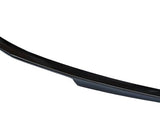 A black car spoiler, smoothly curved and streamlined, sits alone against a plain white background.