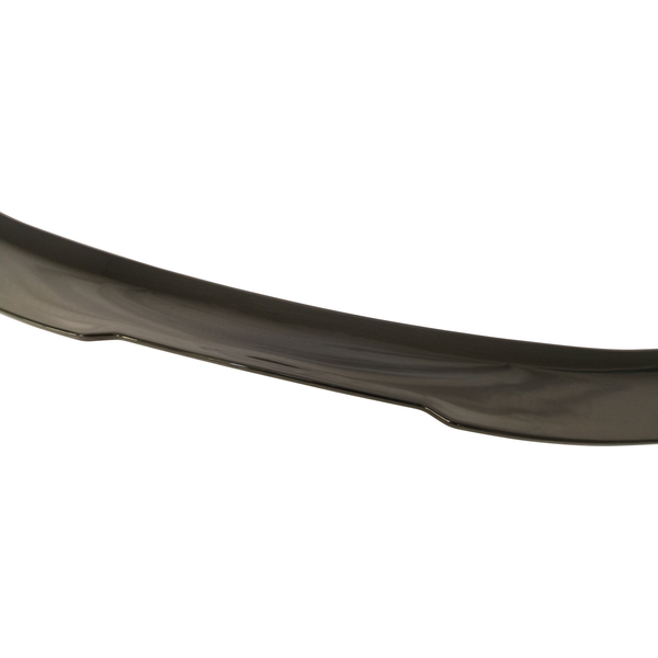 A curved, dark-colored car spoiler rests against a white background, highlighting its sleek and smooth surface texture.