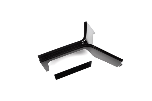 A black, L-shaped bracket with sleek edges and a separate, rectangular piece is positioned on a plain white background.