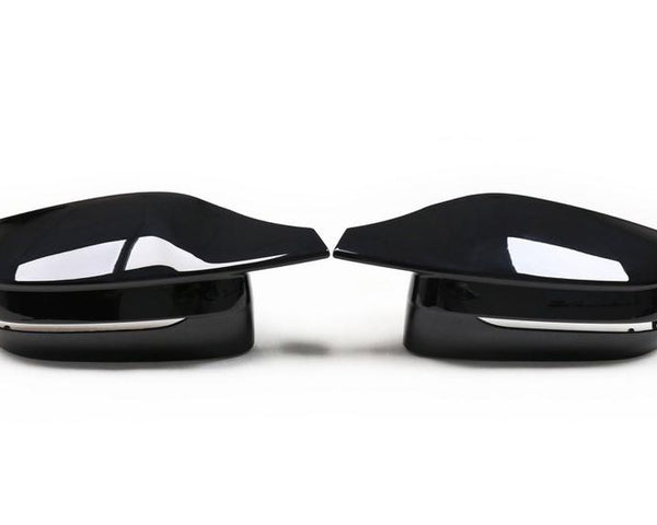 Two glossy black car side mirrors facing each other, set against a plain white background. They have a sleek, aerodynamic design with a subtle chrome accent beneath.