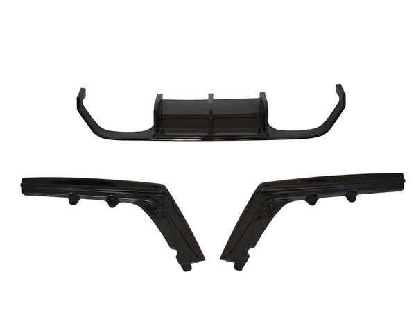 Three black automotive body parts are laid out separately against a white background, comprising a central diffuser and two angled side skirts.