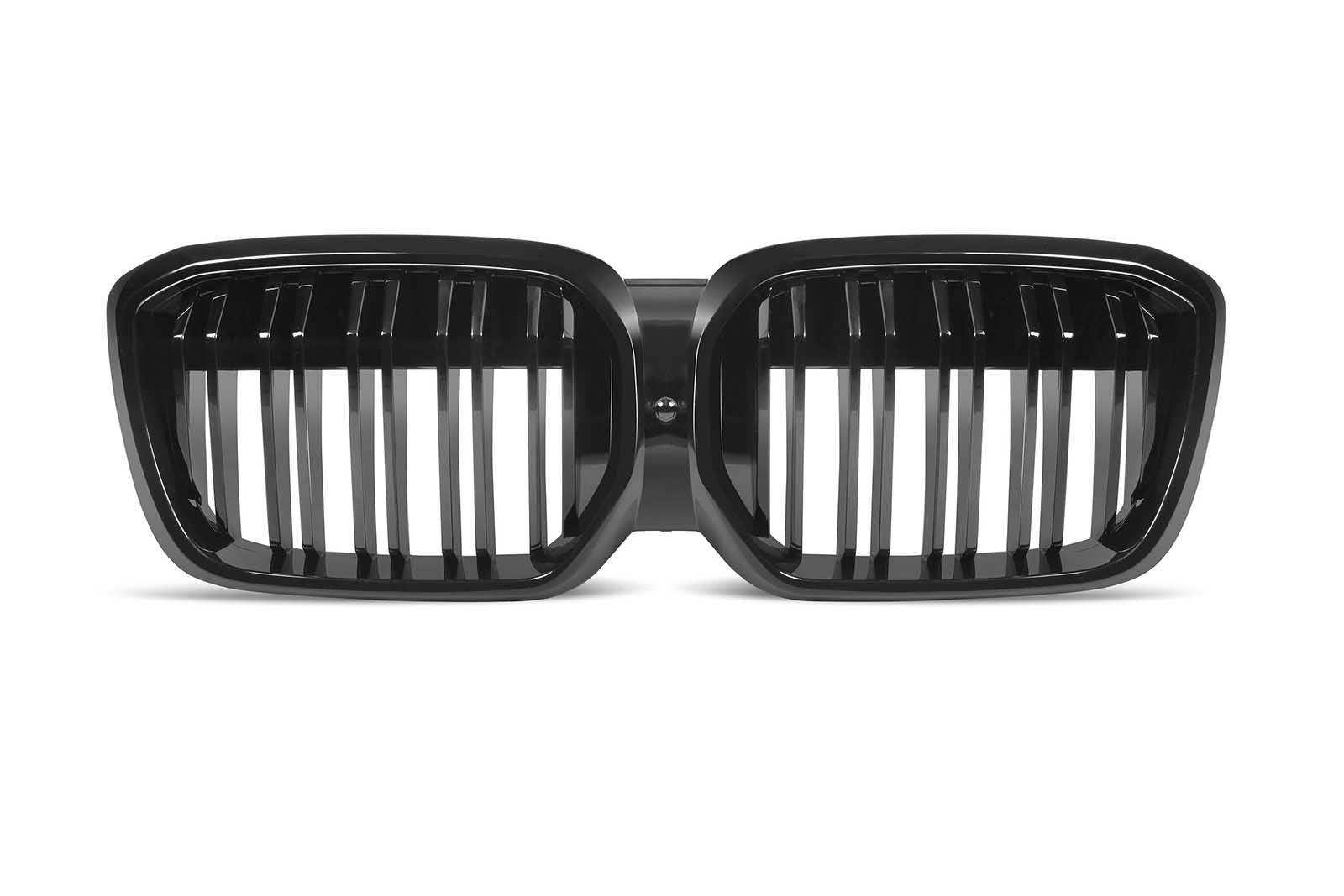 A dual kidney-shaped, black car grille with vertical slats is displayed against a plain white background.