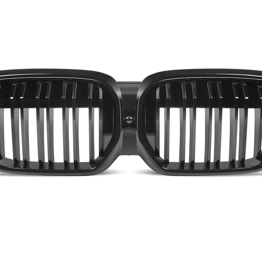 A dual kidney-shaped, black car grille with vertical slats is displayed against a plain white background.