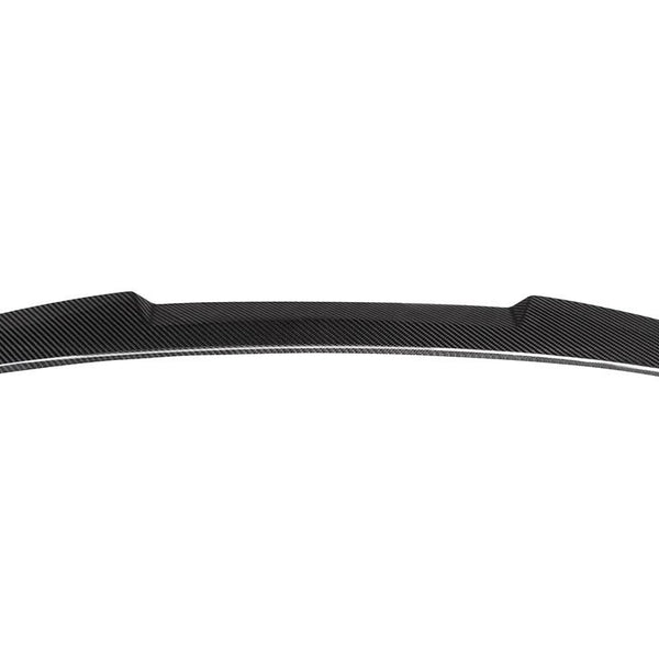 An aerodynamic, black carbon fiber car spoiler sits against a white background, showcasing its sleek, curved design and distinct texture.