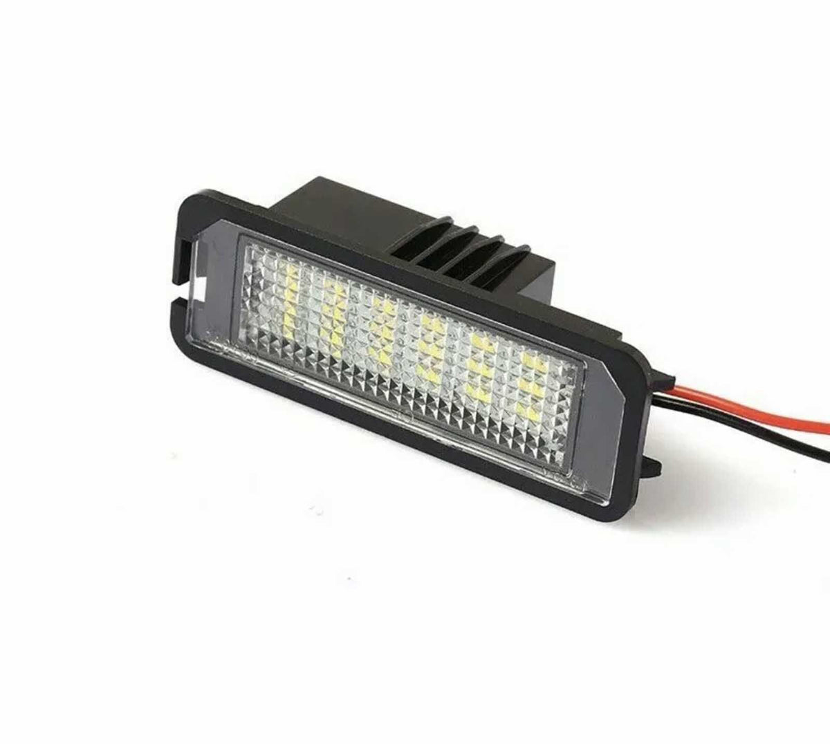 A rectangular LED car light with a textured lens, mounted in a black housing. It has red and black wires extending from the back, shown on a plain white background.